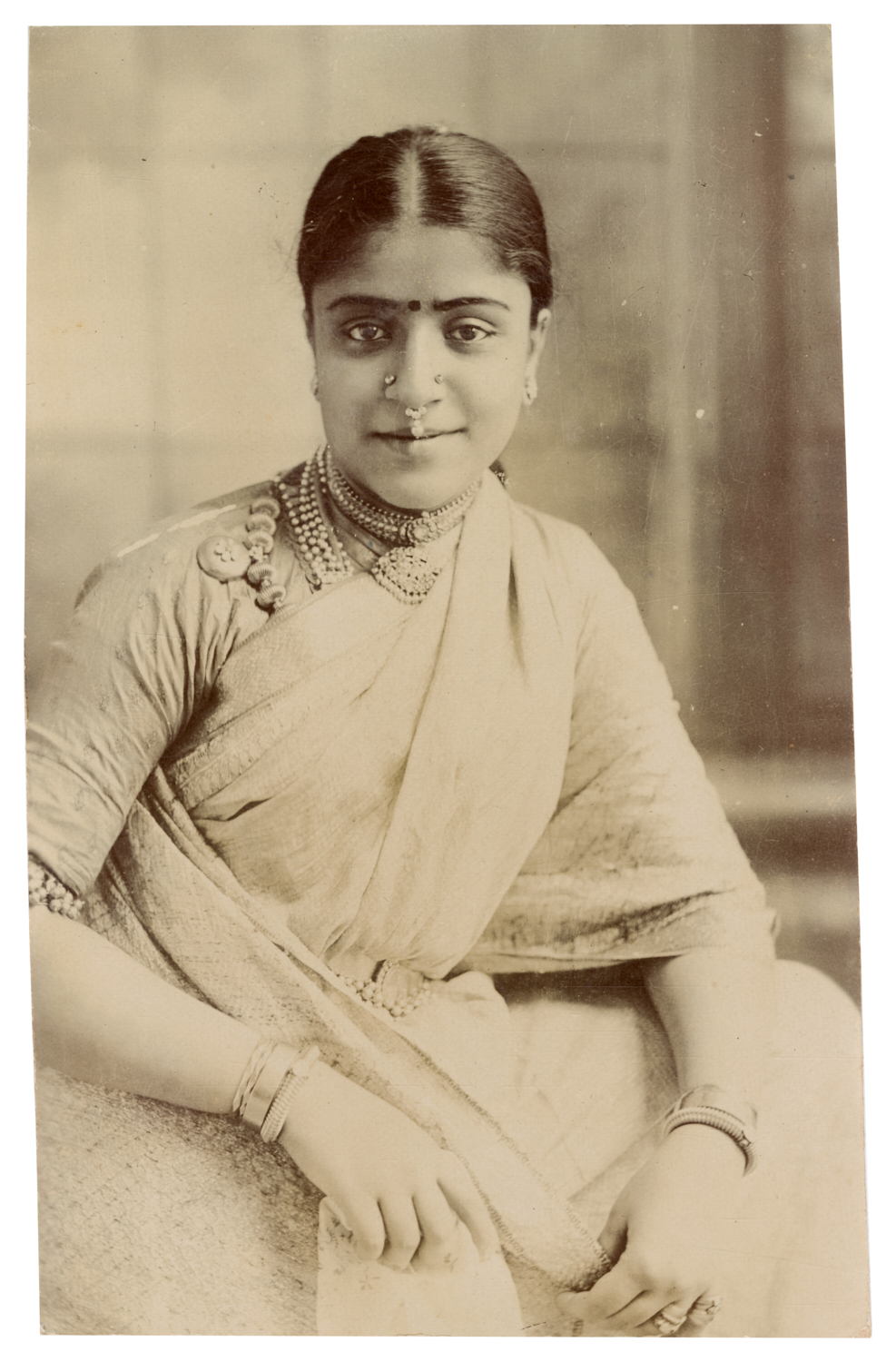 Postcard Depicting a Seated Woman in a Saree